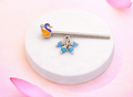 Swan-shaped silver flute with beads
